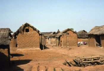 Featured is a photo of a village setting in Burkina Faso, West Africa.